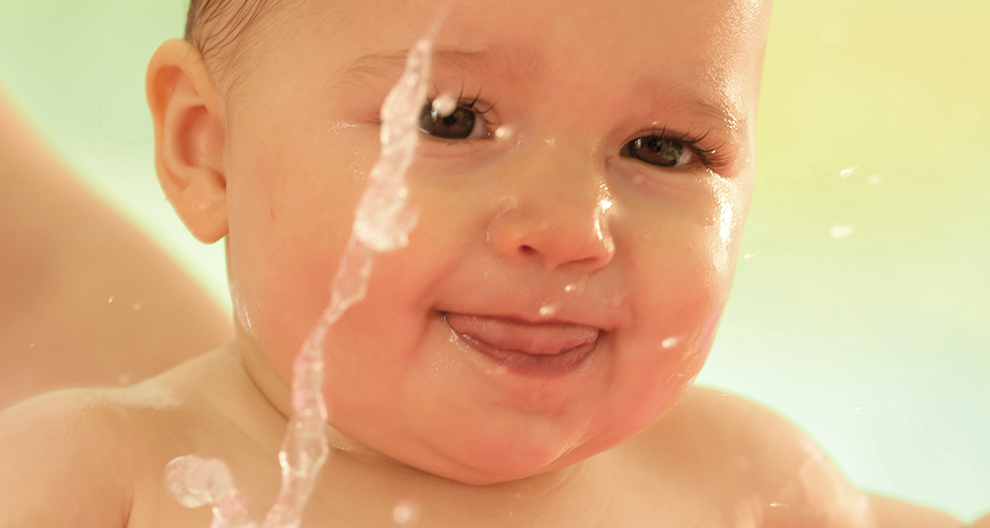 Baby with water droplets.